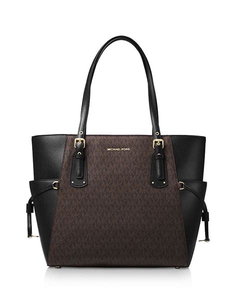 michael kors east west zip tote|signature voyager east west tote.